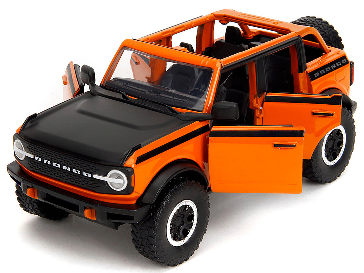 2021 Ford Bronco Open-Top Orange with Black Stripes and Hood with Extra Wheels "Just Trucks" Series 1/24 Diecast Model Car by Jada LuxuryLifeWay Online Store