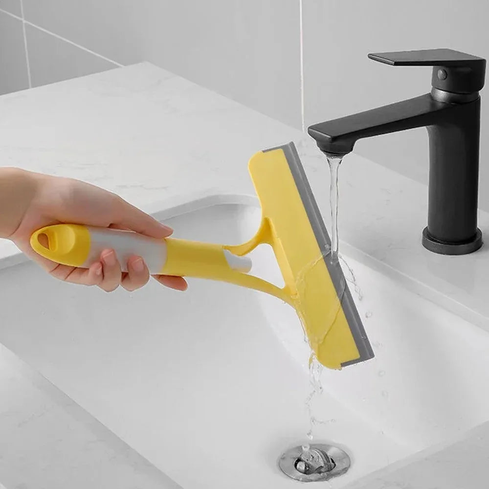 A household glass cleaning scraper that combines the functions of a watering can and a window scraper. Pi-Mart