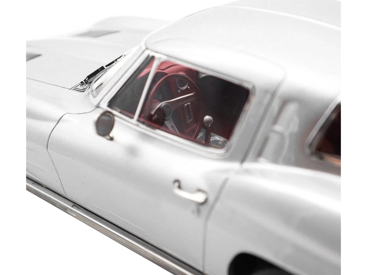 1963 Chevrolet Corvette Sting Ray Sebring Silver Metallic with Red Interior 1/18 Diecast Model Car by Norev LuxuryLifeWay Online Store