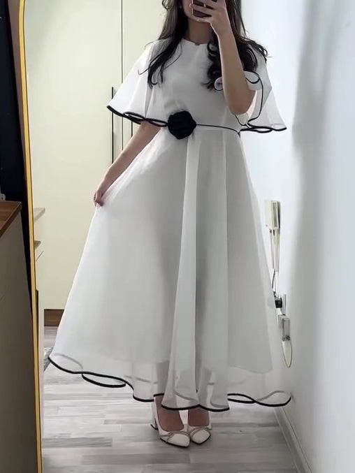 White Chiffon Maxi Dress With Black Trim And Floral Accent NorixaFashion.com