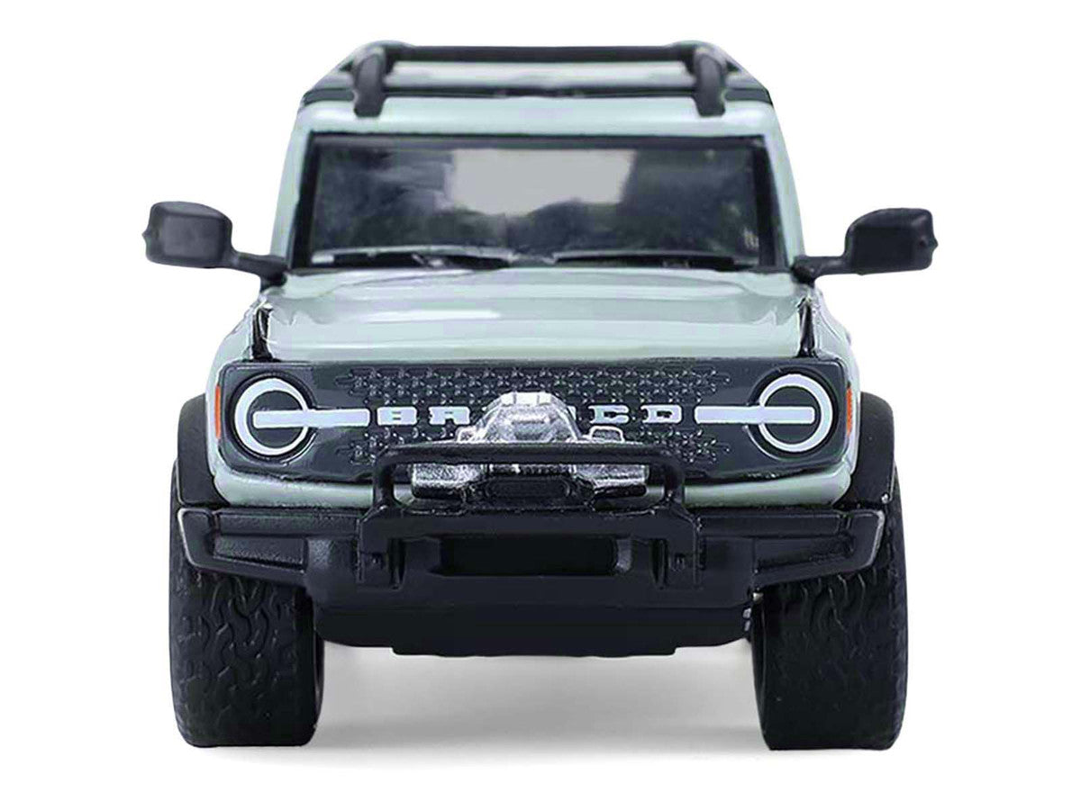 2021 Ford Bronco 4-Door Badlands Cactus Gray with Black Top and Motorcycle with Utility Trailer "Hitch & Tow" Series 33 1/64 Diecast Model Cars by Greenlight LuxuryLifeWay Online Store