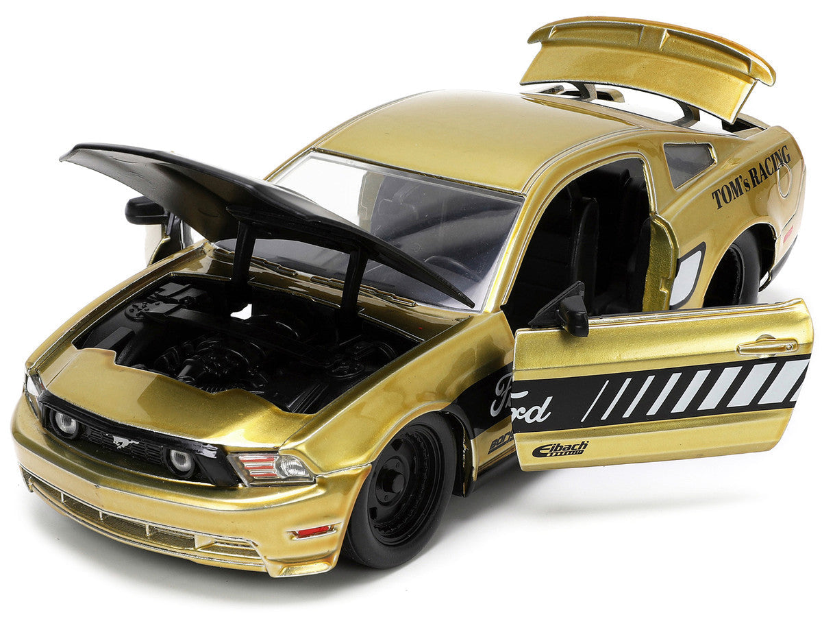 2010 Ford Mustang GT Gold Metallic with Black Graphics and Hood "Tom's Racing" "Bigtime Muscle" Series 1/24 Diecast Model Car by Jada LuxuryLifeWay Online Store