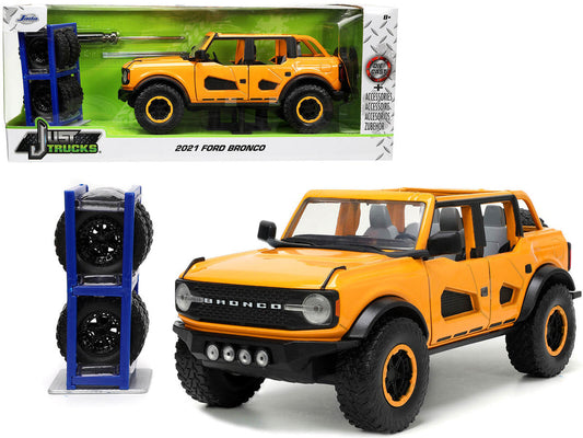 2021 Ford Bronco Orange Metallic with Extra Wheels "Just Trucks" Series 1/24 Diecast Model Car by Jada LuxuryLifeWay Online Store