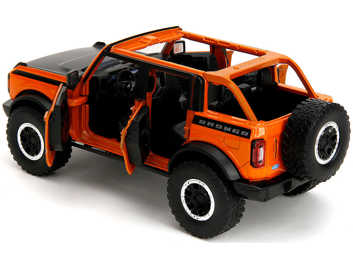 2021 Ford Bronco Open-Top Orange with Black Stripes and Hood with Extra Wheels "Just Trucks" Series 1/24 Diecast Model Car by Jada LuxuryLifeWay Online Store