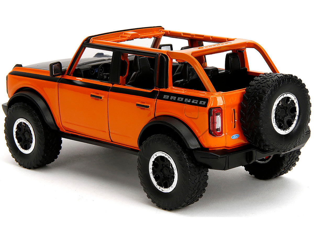 2021 Ford Bronco Open-Top Orange with Black Stripes and Hood with Extra Wheels "Just Trucks" Series 1/24 Diecast Model Car by Jada LuxuryLifeWay Online Store