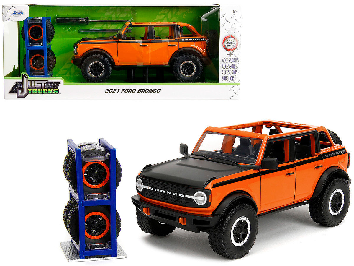 2021 Ford Bronco Open-Top Orange with Black Stripes and Hood with Extra Wheels "Just Trucks" Series 1/24 Diecast Model Car by Jada LuxuryLifeWay Online Store