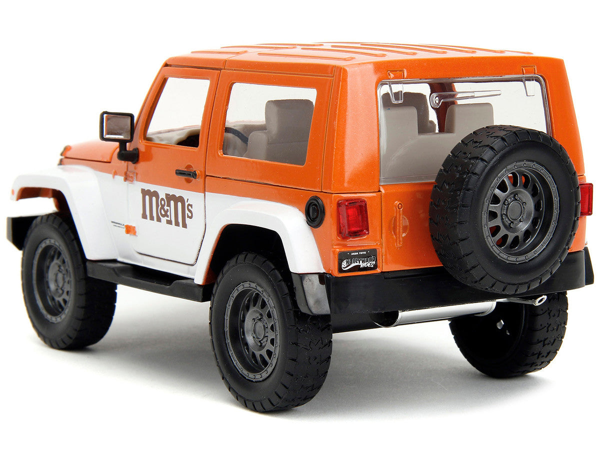 2007 Jeep Wrangler Orange Metallic and White and Orange M&M Diecast Figure "M&M's" "Hollywood Rides" Series 1/24 Diecast Model Car by Jada LuxuryLifeWay Online Store