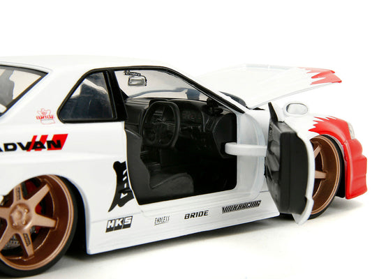 2002 Nissan Skyline GT-R (R34) RHD (Right Hand Drive) White with Red Graphics and Ryu Diecast Figure "Street Fighter" Video Game "Anime Hollywood Rides" Series 1/24 Diecast Model Car by Jada LuxuryLifeWay Online Store
