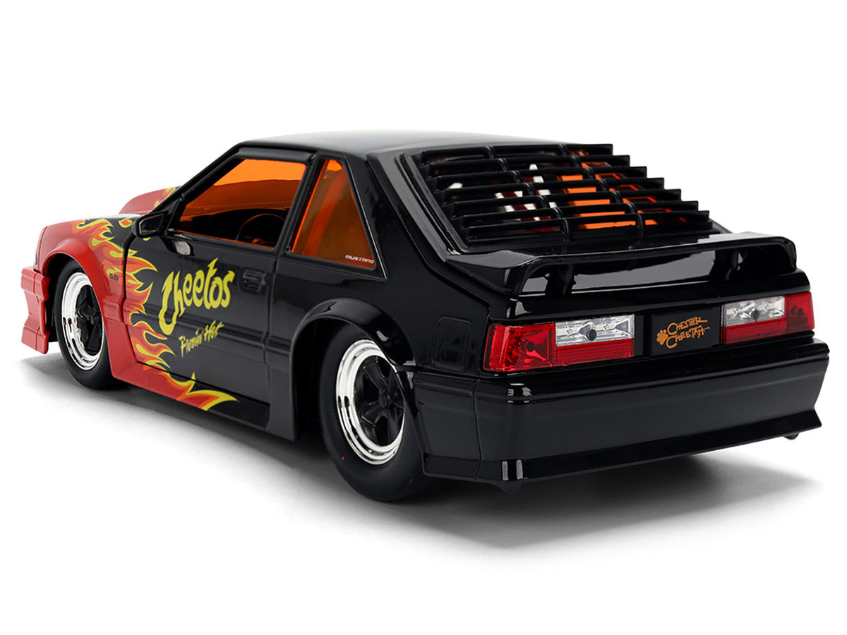 1989 Ford Mustang GT Black with Red Flame Graphics and Chester Cheetah Diecast Figure "Cheetos Flamin' Hot" "Hollywood Rides" Series 1/24 Diecast Model Car by Jada LuxuryLifeWay Online Store