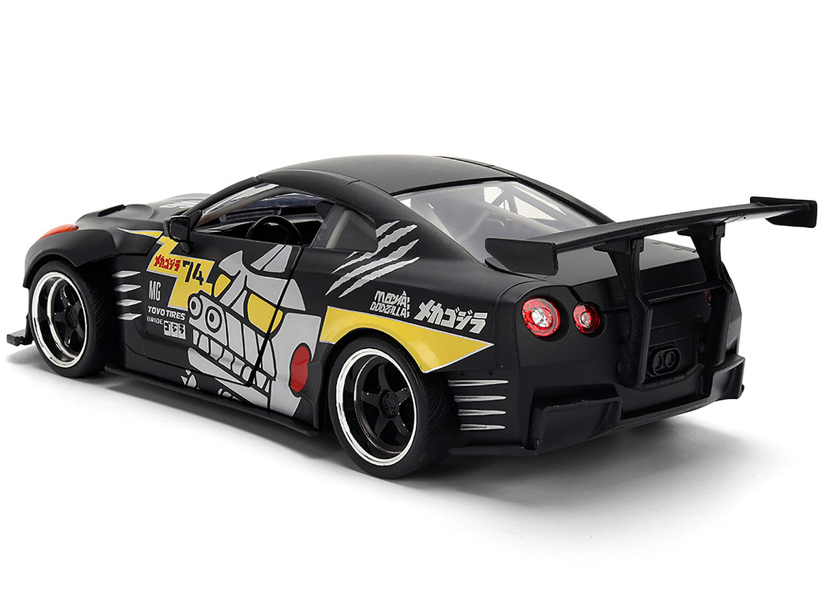 2009 Nissan GT-R (R35) Ben Sopra Matt Black with "Mechagodzilla" Graphics "Hollywood Rides" Series 1/24 Diecast Model Car by Jada LuxuryLifeWay Online Store