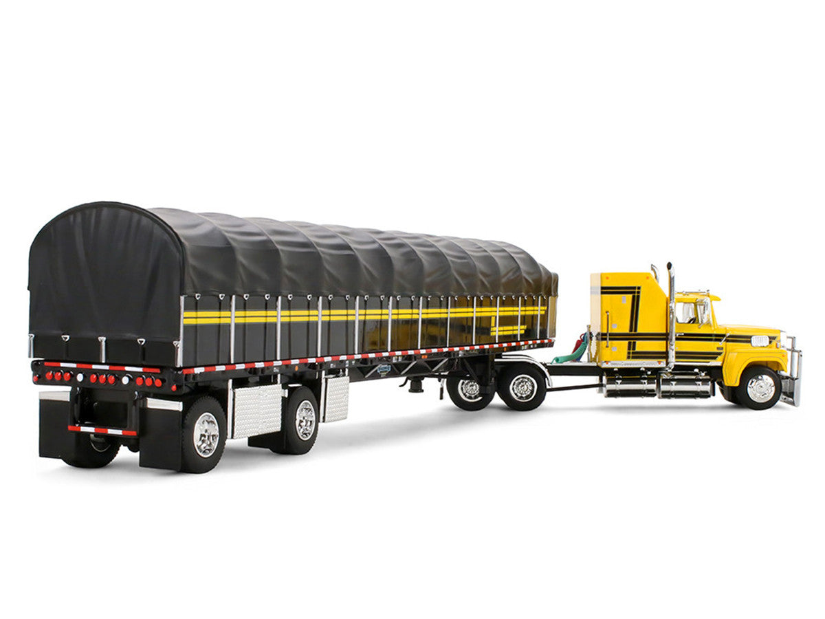 Ford LTL 9000 with 60" Aerodyne Sleeper and 53' Wilson Roadbrute Flatbed Trailer with Covered Wagon Yellow with Black Stripes 1/64 Diecast Model by DCP/First Gear LuxuryLifeWay Online Store
