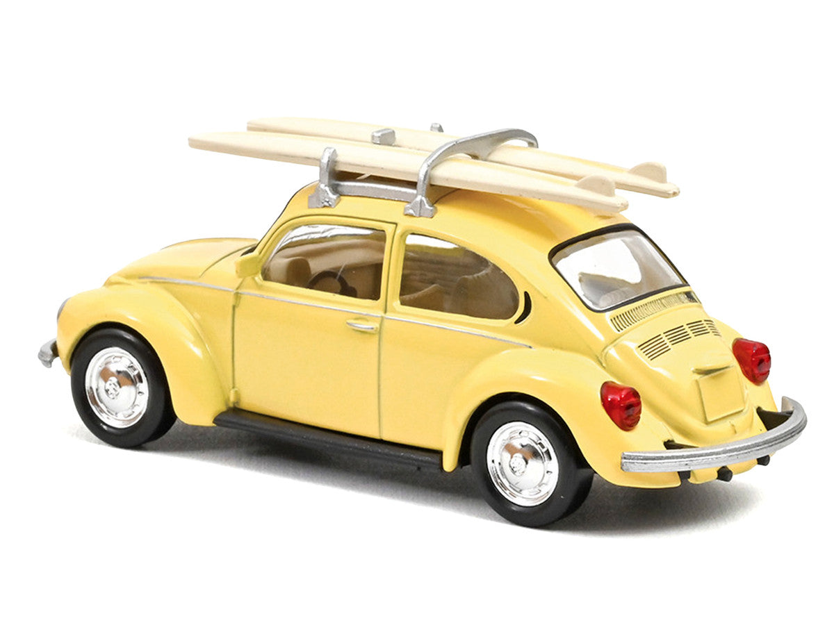 1973 Volkswagen Beetle 1303 Pastel Yellow with Roof Rack and 2 Surfboards 1/43 Diecast Model Car by Norev LuxuryLifeWay Online Store