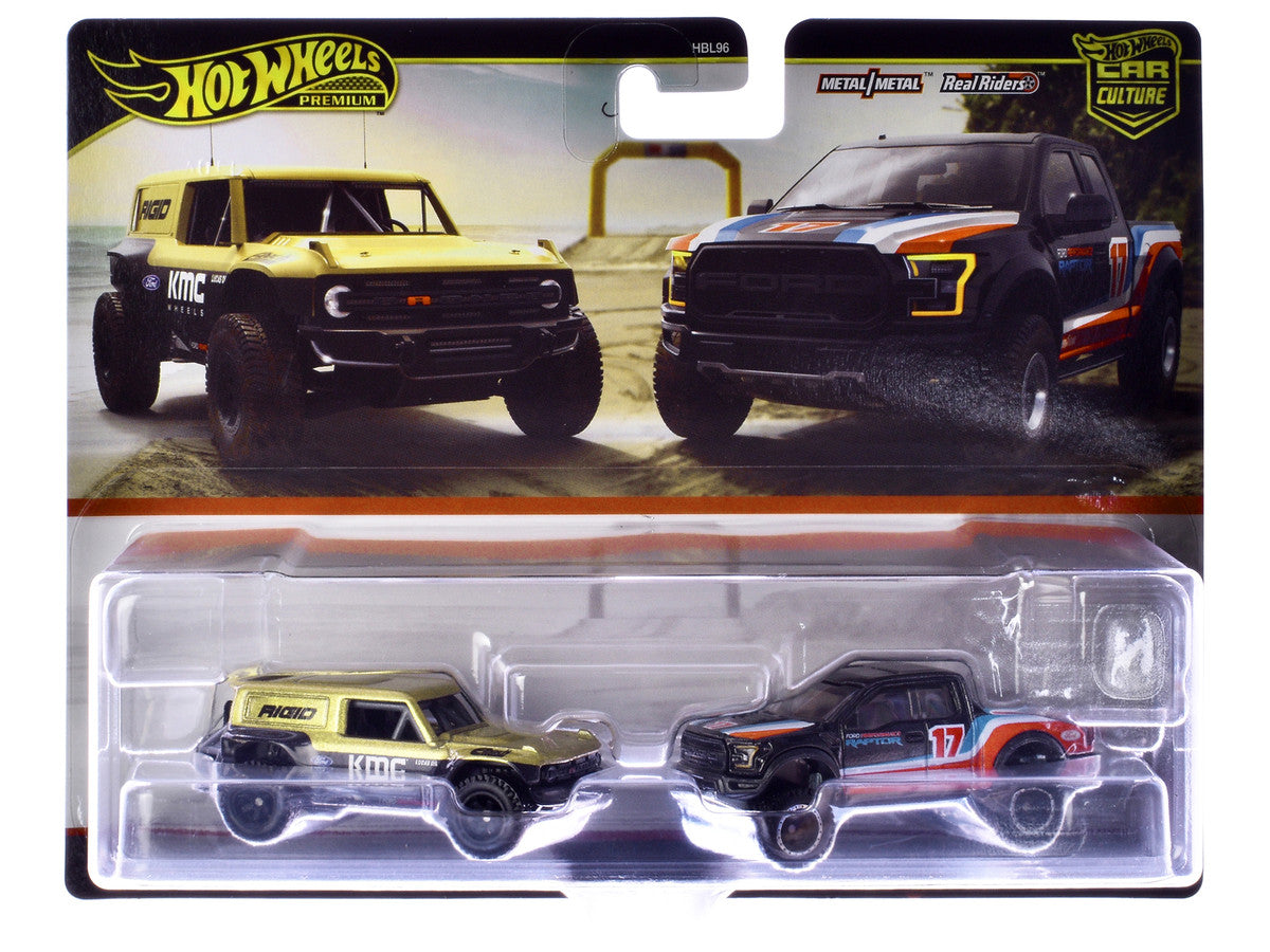 Ford Bronco R Gold Metallic and Black and 2017 Ford F-150 Raptor Pickup Truck #17 Black with Stripes "Car Culture" Set of 2 Cars Diecast Model Cars by Hot Wheels LuxuryLifeWay Online Store