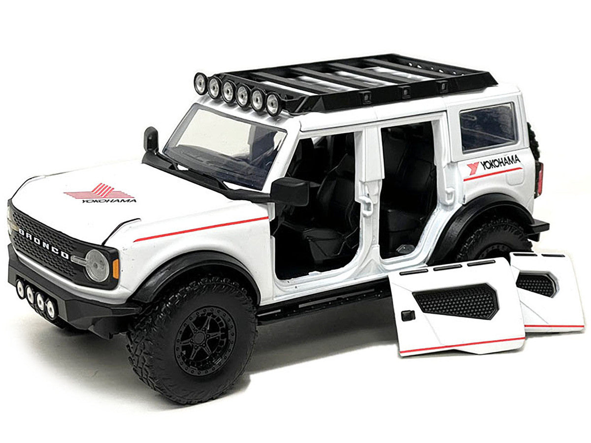 2021 Ford Bronco White with Red Stripes and Roof Rack "Yokohama Tires" "Just Trucks" Series 1/24 Diecast Model Car by Jada LuxuryLifeWay Online Store