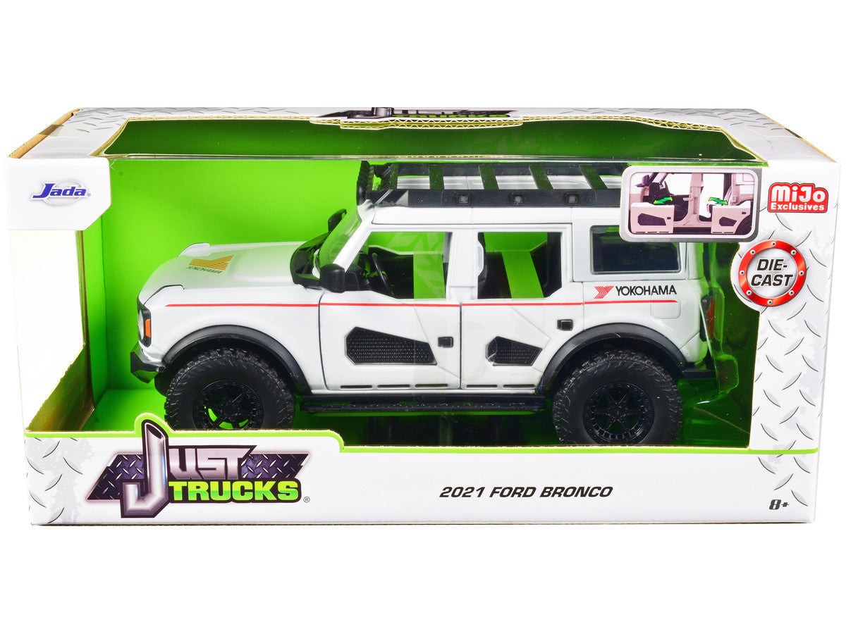 2021 Ford Bronco White with Red Stripes and Roof Rack "Yokohama Tires" "Just Trucks" Series 1/24 Diecast Model Car by Jada LuxuryLifeWay Online Store