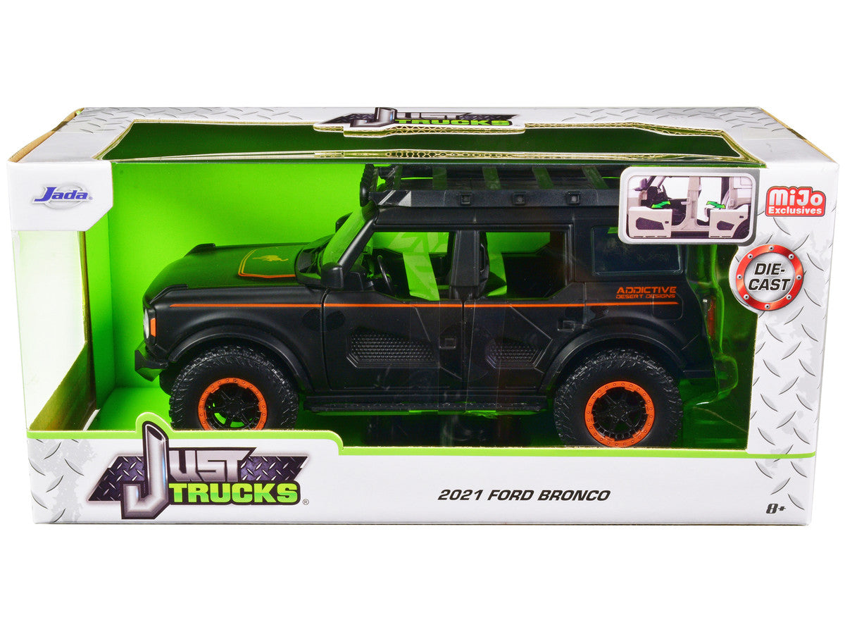 2021 Ford Bronco Matt Black with Orange Stripes and Roof Rack "Addictive Desert Designs" "Just Trucks" Series 1/24 Diecast Model Car by Jada LuxuryLifeWay Online Store