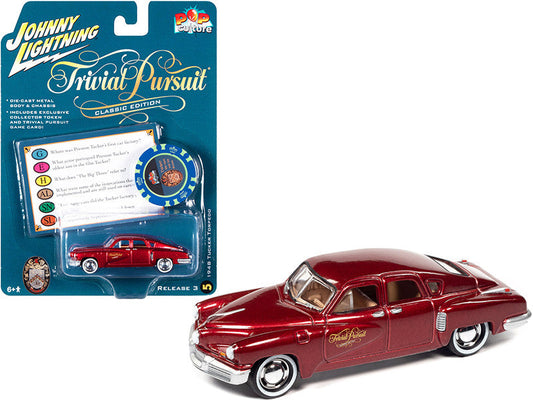 1948 Tucker Torpedo Red Maroon Metallic "Tucker: The Man and His Dream" (1988) Movie with Poker Chip (Collector Token) and Game Card "Trivial Pursuit" "Pop Culture" Series 3 1/64 Diecast Model Car by Johnny Lightning LuxuryLifeWay Online Store