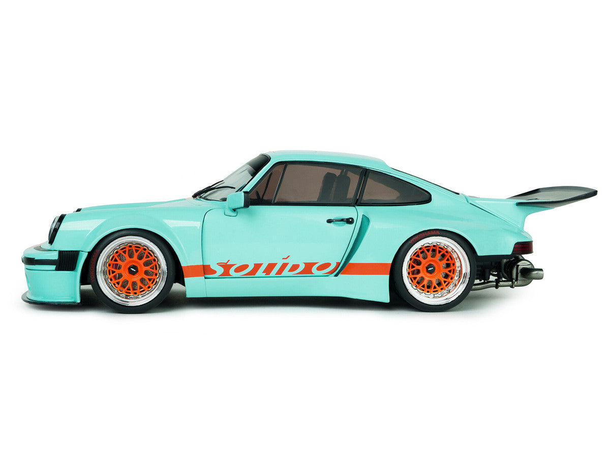 2025 Porsche 911 KS-R by Khyzyl Saleem "Blue Racer" Light Blue with Orange Stripes 1/18 Diecast Model Car by Solido