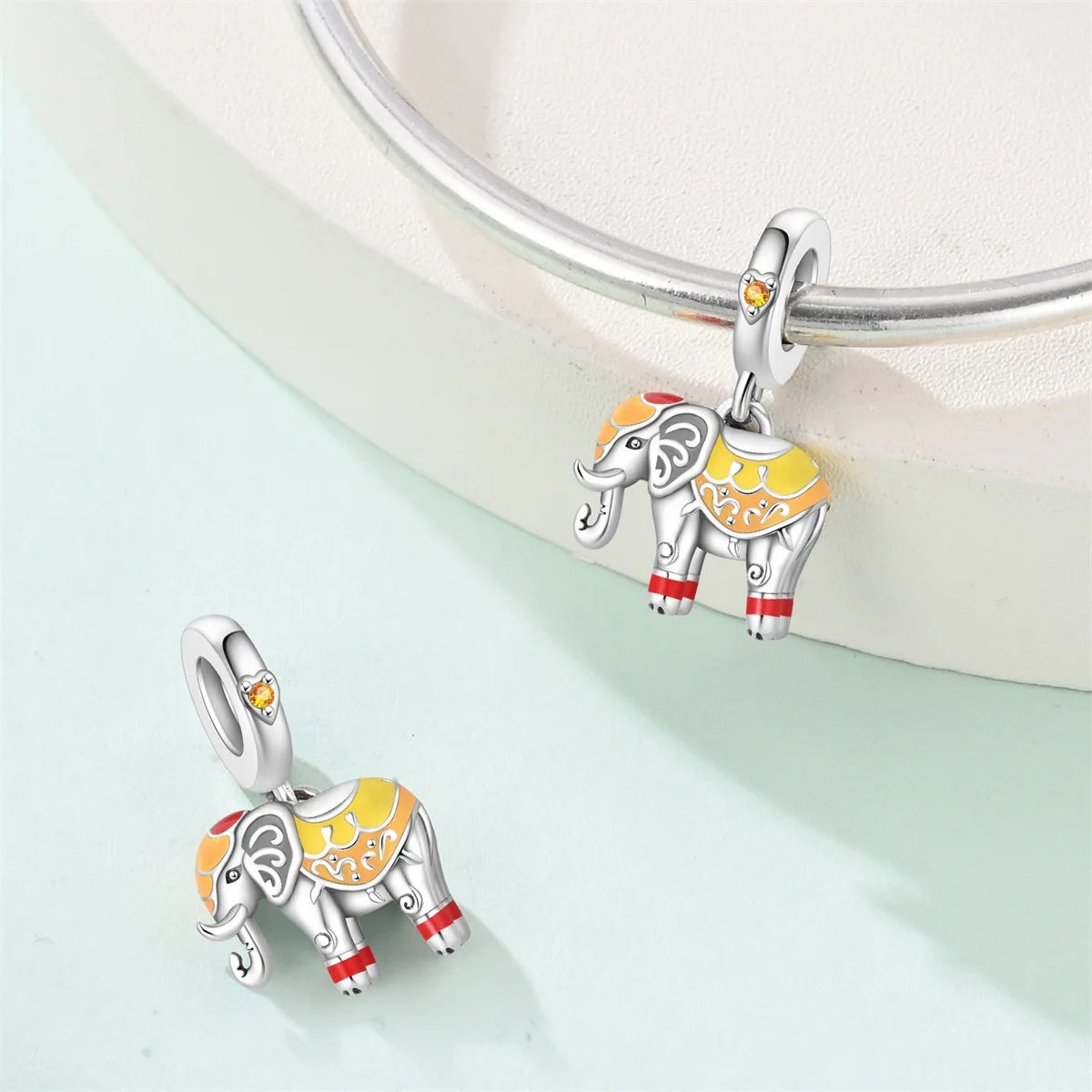 Attractive pendant featuring an animal - a baby elephant, a cat, a swan. Beaded DIY jewelry for a bracelet accessory. Pi-Mart