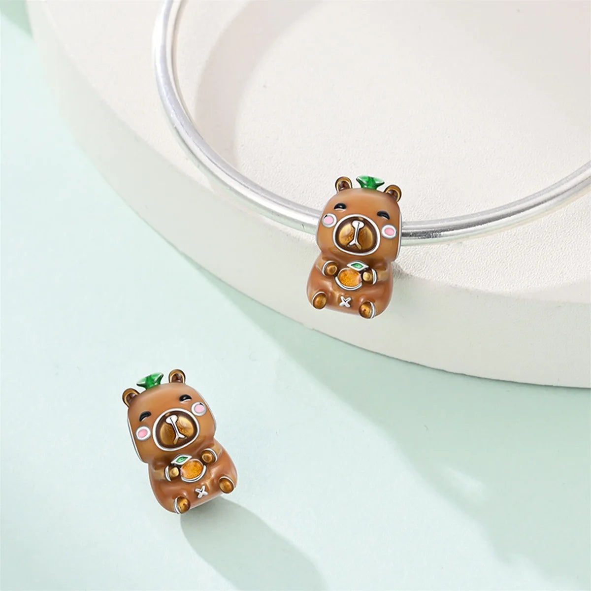 Attractive pendant featuring an animal - a baby elephant, a cat, a swan. Beaded DIY jewelry for a bracelet accessory. Pi-Mart