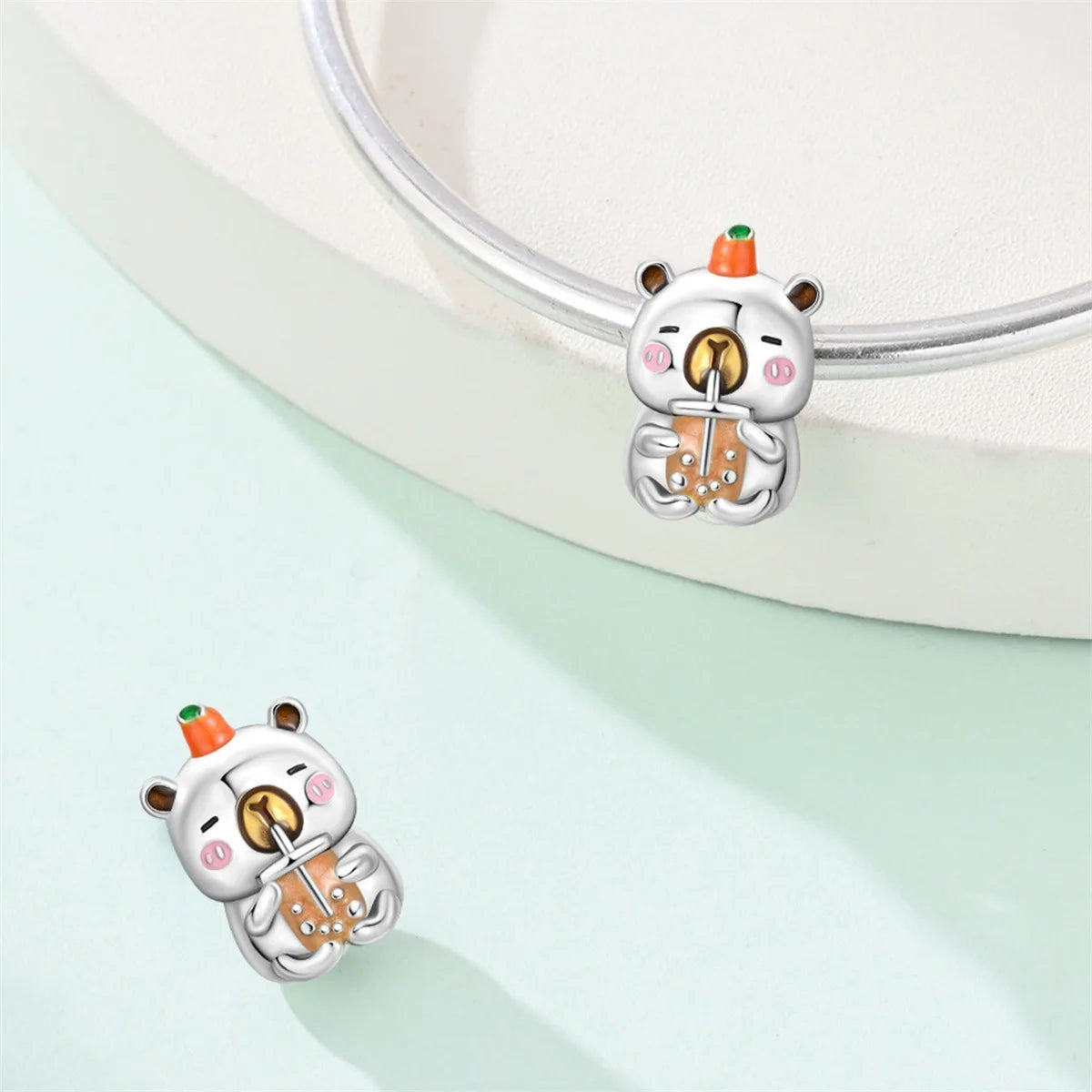 Attractive pendant featuring an animal - a baby elephant, a cat, a swan. Beaded DIY jewelry for a bracelet accessory. Pi-Mart