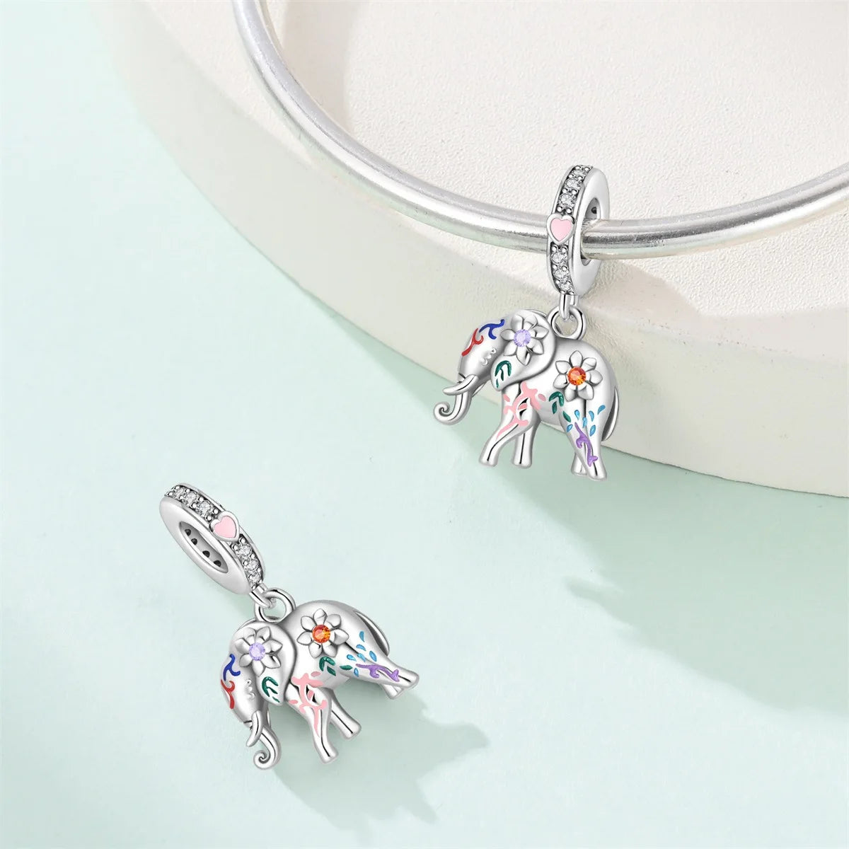 Attractive pendant featuring an animal - a baby elephant, a cat, a swan. Beaded DIY jewelry for a bracelet accessory. Pi-Mart