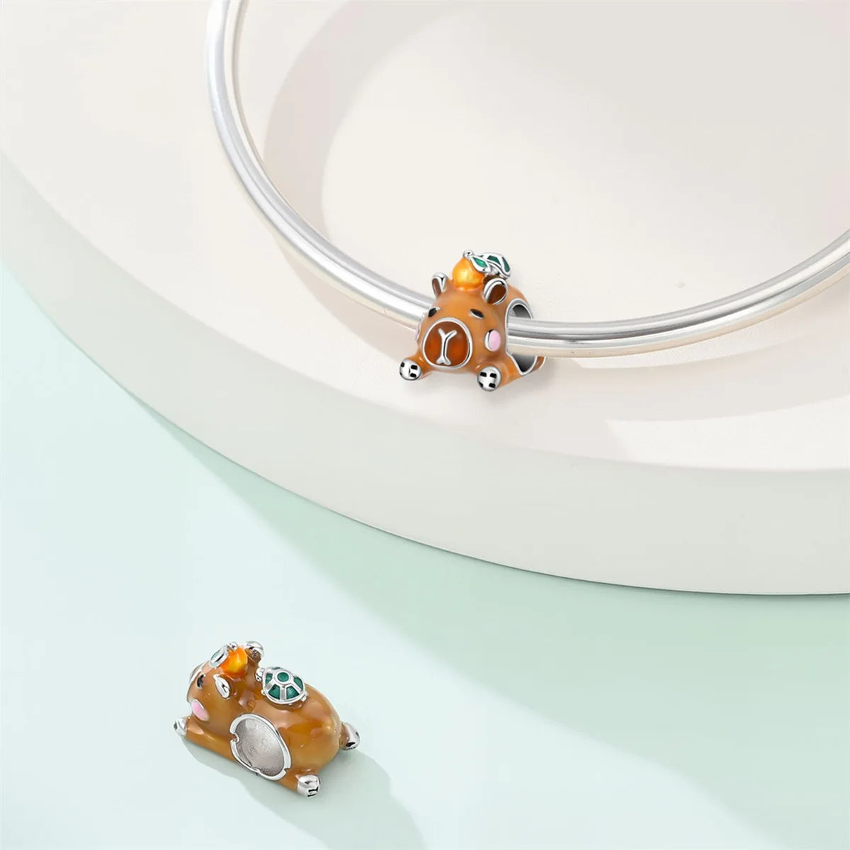 Attractive pendant featuring an animal - a baby elephant, a cat, a swan. Beaded DIY jewelry for a bracelet accessory. Pi-Mart