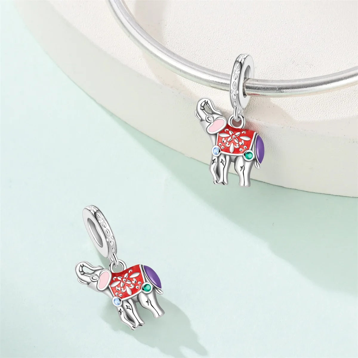 Attractive pendant featuring an animal - a baby elephant, a cat, a swan. Beaded DIY jewelry for a bracelet accessory. Pi-Mart