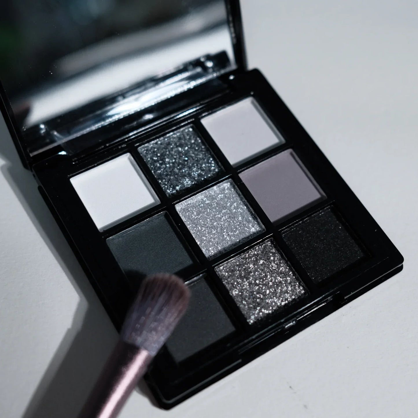 9-shade eyeshadow palette: Black Swan, Smoky, Dark Black, Grey Silver Glitter, Matte Finish, Long-lasting, and easy to color LadyShow.Store