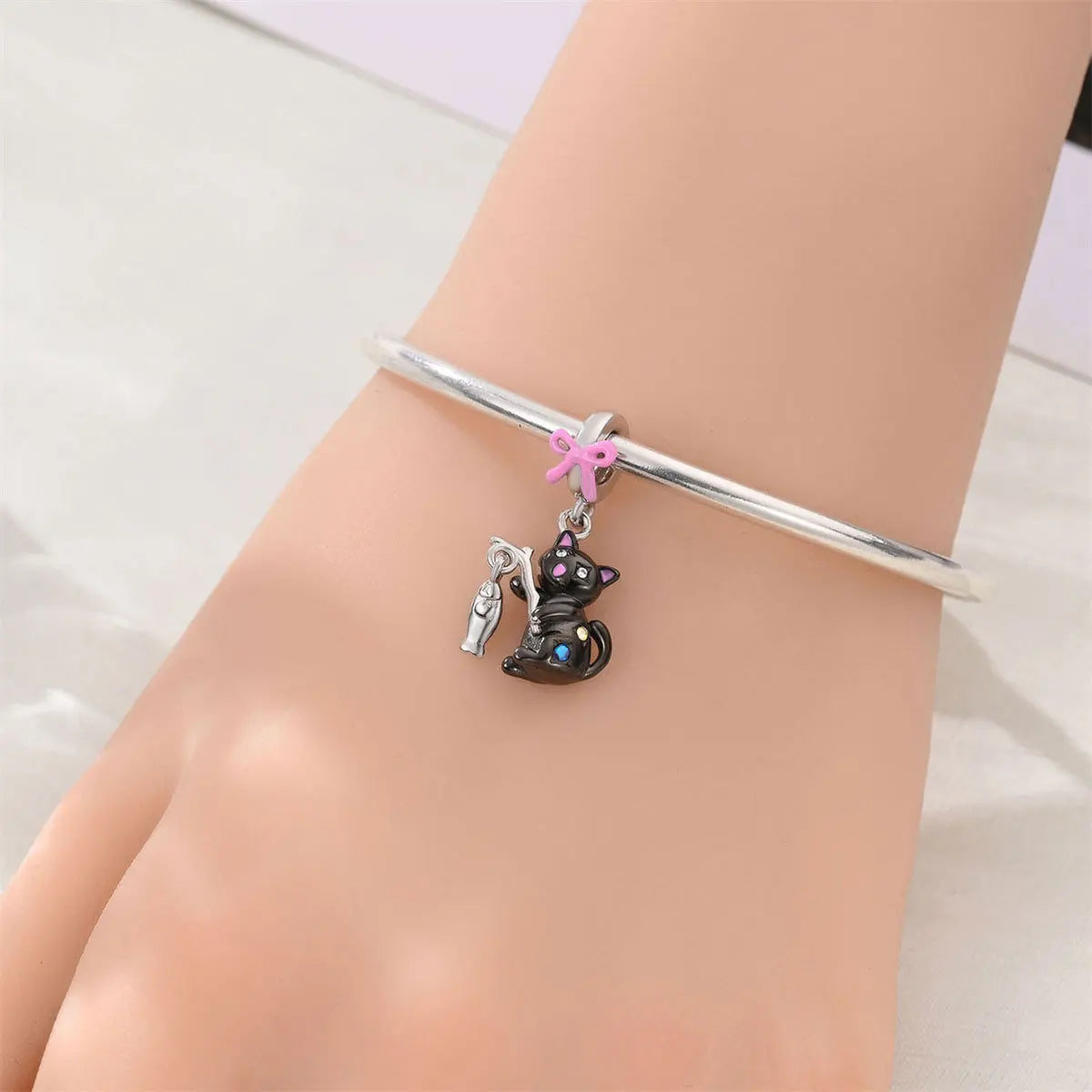Attractive pendant featuring an animal - a baby elephant, a cat, a swan. Beaded DIY jewelry for a bracelet accessory. Pi-Mart