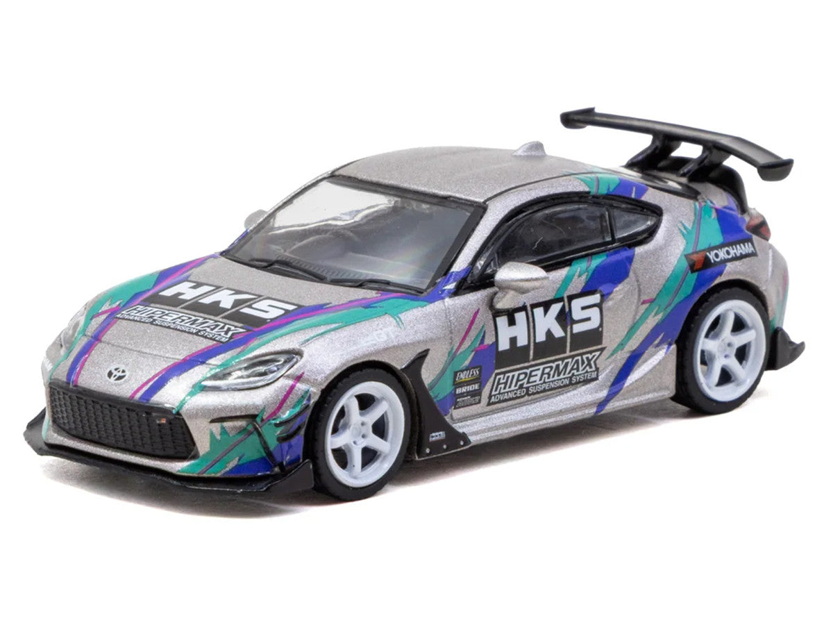 Toyota GR86 RHD (Right Hand Drive) "HKS" Gray Metallic with Graphics and Metal Oil Can Packaging "Global64" Series 1/64 Diecast Model Car by Tarmac Works LuxuryLifeWay Online Store