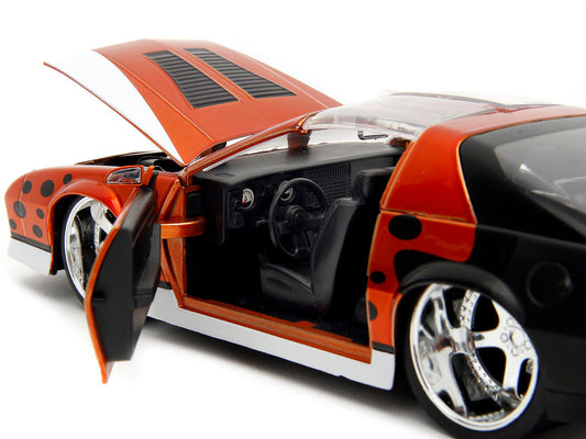 1985 Chevrolet Camaro Z/28 Orange Metallic with Graphics and Chester Cheetah Diecast Figure "Cheetos" "Hollywood Rides" Series 1/24 Diecast Model Car by Jada LuxuryLifeWay Online Store